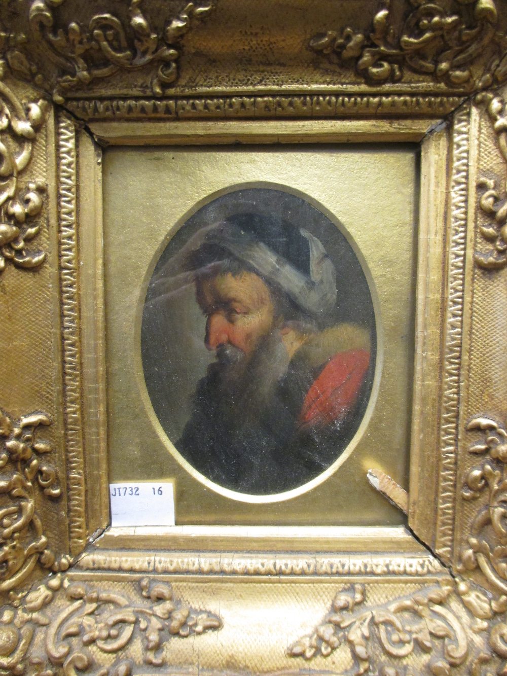 A late 18th century portrait of an elderly gentleman, bearded and wearing fur, oil on board (?),