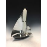 An Art Deco chrome table lamp in the form of a yacht, registered design no. 875880, the mast as a