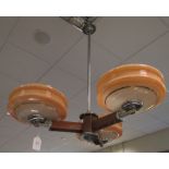 A three-branch walnut and chrome ceiling light, the chrome rod supporting three walnut arms, each