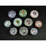 A collection of ten Perthshire and other Scottish spoke design paperweights, of varying colours, one