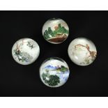 Four 'Chinese White' glass paperweights, variously depicting topographical and ornothological scenes