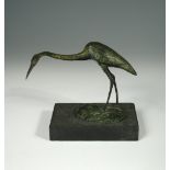 § David Wynne, (British, 1926-2014), a bronze model of a heron, standing craning its neck