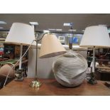 A large ceramic table lamp and three other lamps