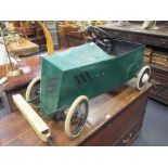 An early 20th century painted metal child's pedal car