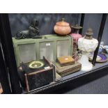 A marble mantel clock (A/F), a table top cabinet, two oil lamps with glass reservoirs, two Middle