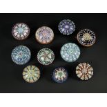 A collection of ten Perthshire spoke pattern paperweights, of varying colours, some with