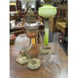 Two oil lamps with glass shades, reservoirs and funnels