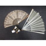 A pair of mother of pearl opera glasses and two fans (3)