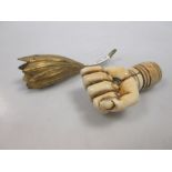 A 19th century carved ivory parasol handle in the form a hand and a gilt metal posy holder (2)