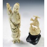 An ivory figure of Lu Dong Bin and another of fishermen, the Daoist immortal stands with his sword