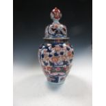 A late 19th/early 20th century Imari jar and cover, the ovoid body painted with two blue framed