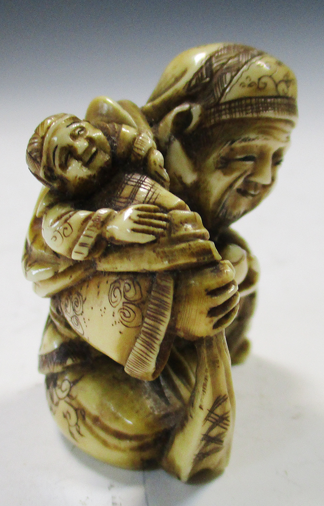 Two late 19th/early 20th century marine ivory netsuke, Ebisu seated with a child in the sack that he - Image 3 of 8