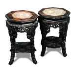 Two similar marble topped hardwood vase stands, beaded rims to the octagonal tops above gadrooned