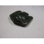 A spinach green jade eagle pendant, probably Shang dynasty, carved in flight, the suspension holes