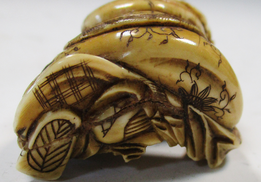 Two late 19th/early 20th century marine ivory netsuke, Ebisu seated with a child in the sack that he - Image 5 of 8