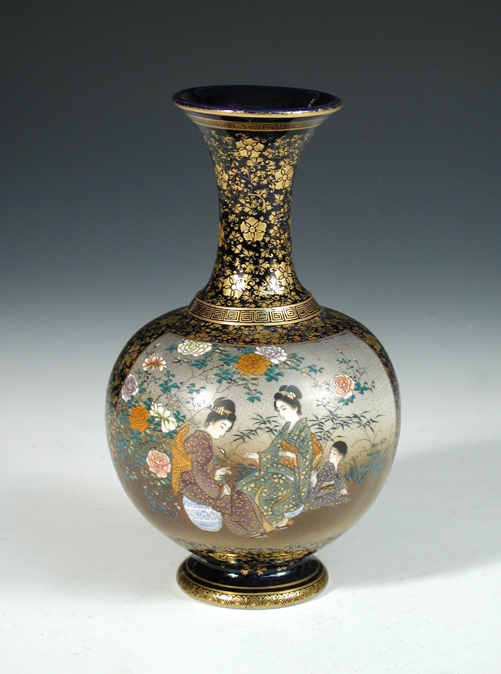 An early 20th century Satsuma blue ground baluster vase, the compressed spherical body painted on