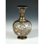 An early 20th century Satsuma blue ground baluster vase, the compressed spherical body painted on
