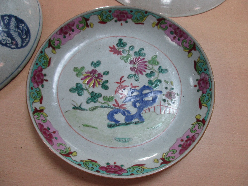 Two 19th century Canton dishes and an earlier blue and white dish, the centre of the smaller - Image 6 of 7