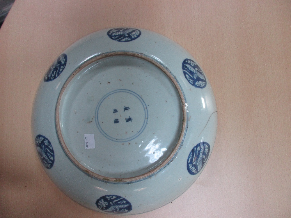 Two 19th century Canton dishes and an earlier blue and white dish, the centre of the smaller - Image 3 of 7
