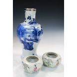 An 18th century blue and white vase together with a pair of famille rose jarlets, the baluster