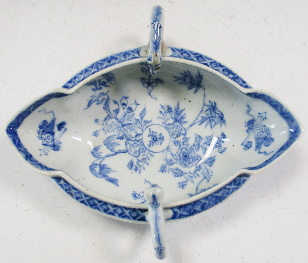 An 18th century blue and white double lipped sauce boat, the head terminals looking into the - Image 2 of 5