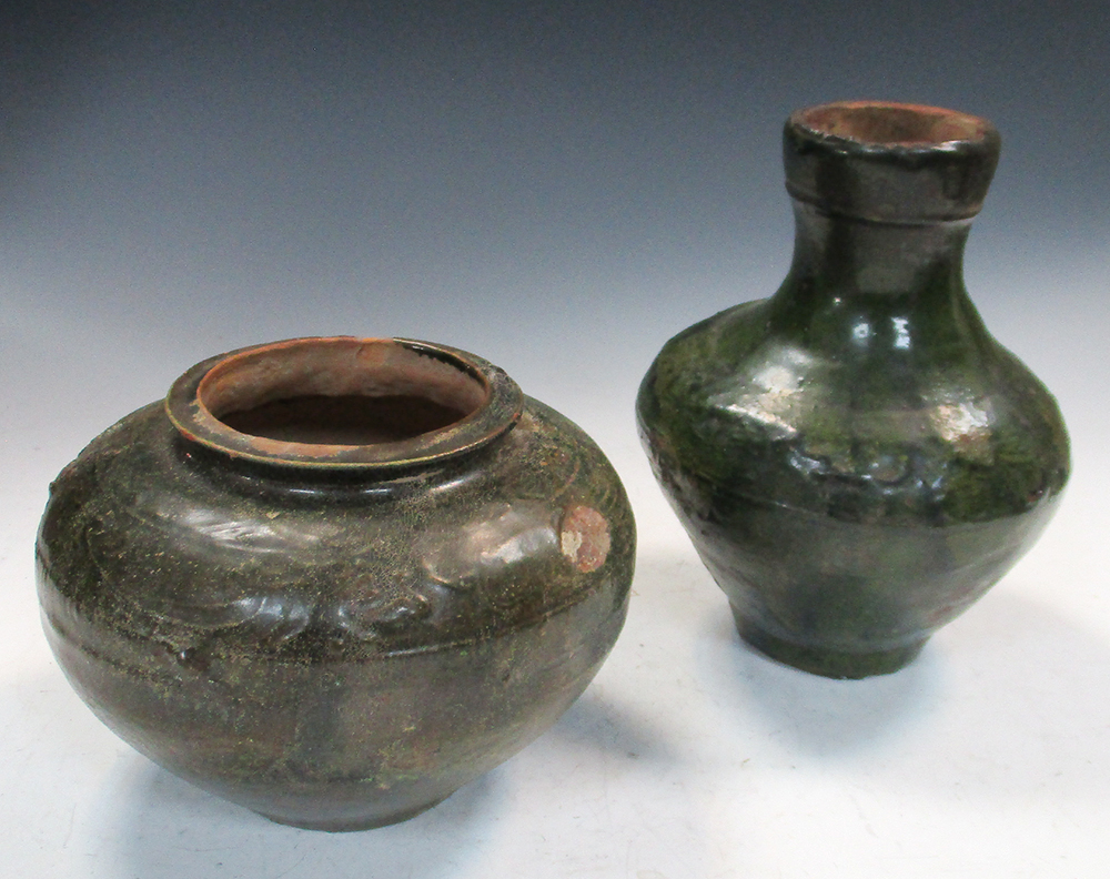 A Han dynasty green glazed baluster vase and a jar, the first with glaze free spur marks on the