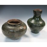 A Han dynasty green glazed baluster vase and a jar, the first with glaze free spur marks on the