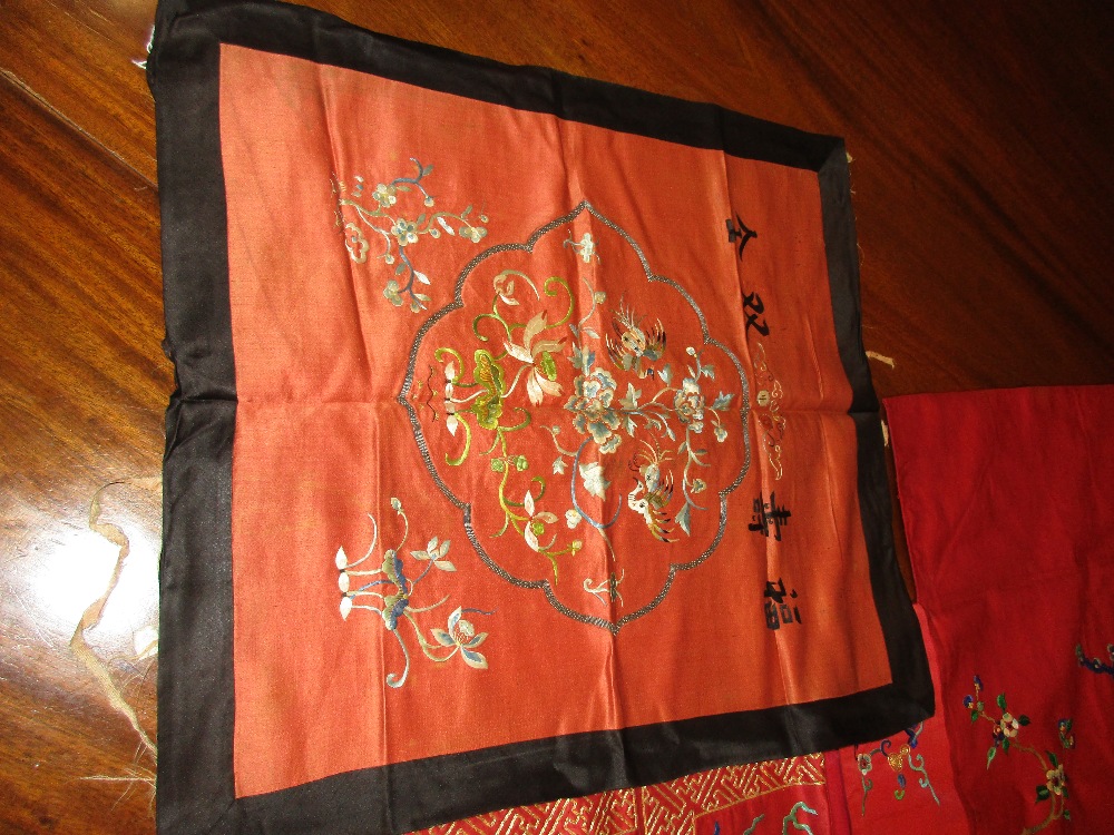 A set of four red silk panels and another, each of the set embroidered in gold thread with a - Image 4 of 4