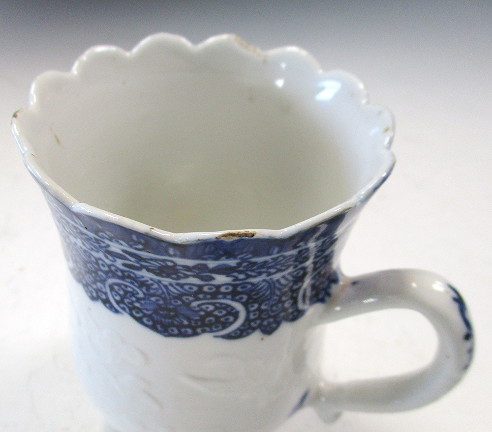 An 18th century blue and white mug, possibly soft paste, the bell shape painted with three - Image 2 of 5