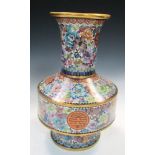 A 20th century cloisonne floral ground baluster vase, the flared rim to a cylindrical neck worked