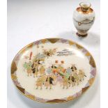 Kozan', a Satsuma plate together with a vase, the plate painted with the procession of a palanquin