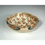 A 19th century Satsuma bowl, the rounded square interior gilt and painted with cherry blossoms,