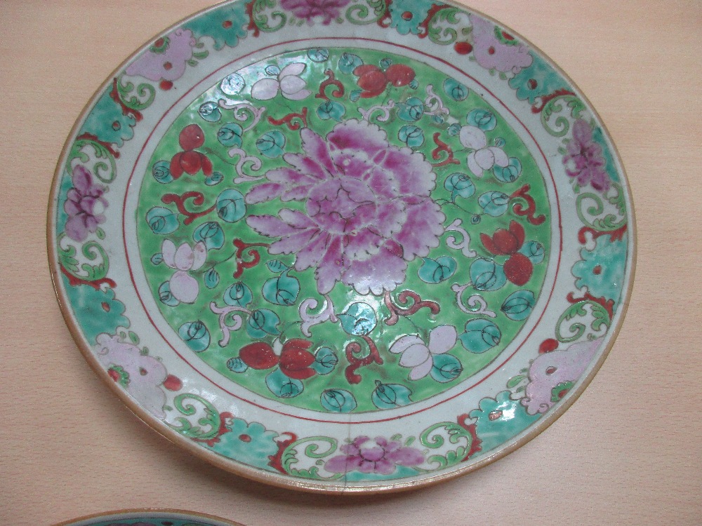 Two 19th century Canton dishes and an earlier blue and white dish, the centre of the smaller - Image 4 of 7