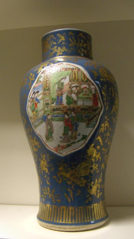 A 19th century blue ground famille verte vase, the baluster shape painted with figures inside