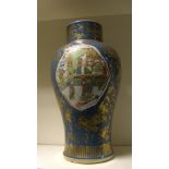A 19th century blue ground famille verte vase, the baluster shape painted with figures inside