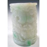 A jadeite cong, the white exterior of the cylindrical shape carved in relief with two dragons