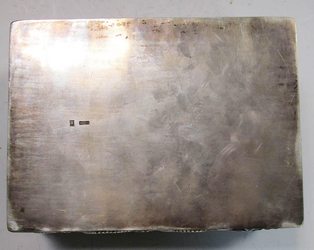 An early 20th century silver double cigarette box, the rectangular hinged lid and sides cast in - Image 5 of 6