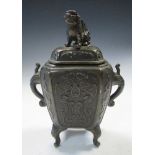 An early 20th century bronze censer and cover, the latter surmounted by a Buddhist lion, the