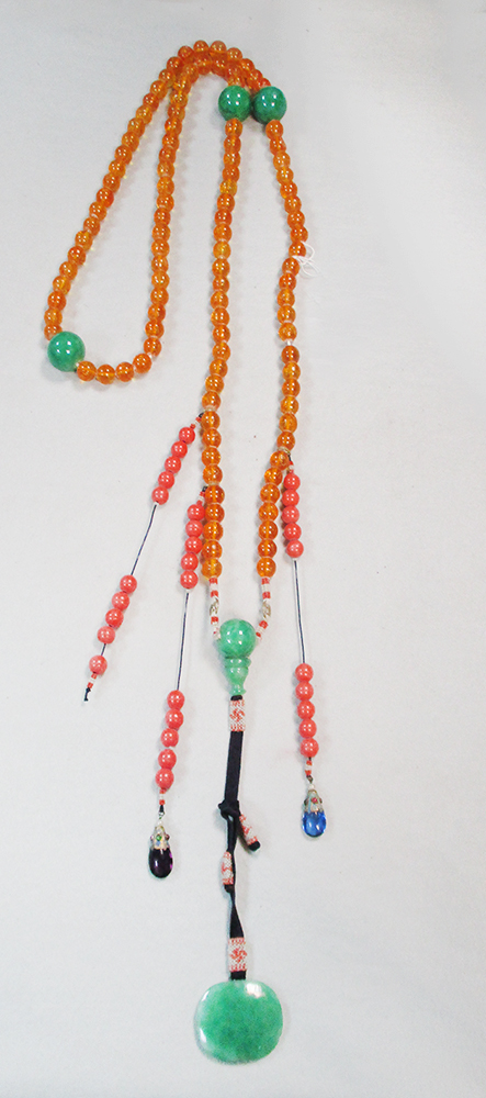 A mandarin's necklace, the main set of beads to imitate amber, interspaced with larger beads to