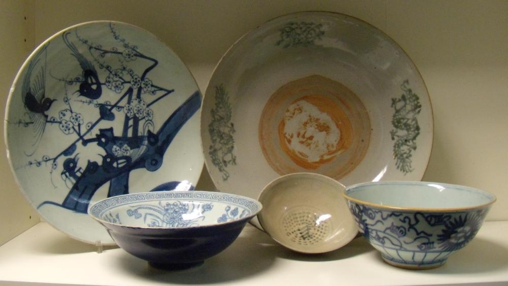 Five Chinese provincial blue and white wares, the smallest of the three bowls with stippled