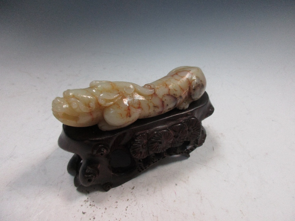 A jade qilin with wood stand, the pale green stone 'mud cracked' in brown and with black mossy - Image 2 of 3