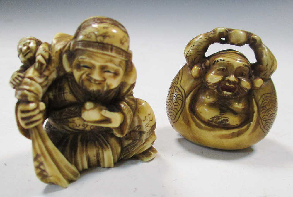 Two late 19th/early 20th century marine ivory netsuke, Ebisu seated with a child in the sack that he