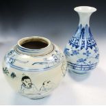 A modern Ming taste blue and white vase and a jar, the vase with a flared neck above stiff leaves on