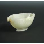 A Mughal taste nephrite bowl, possibly 18th century, the crests of the bird's head handles to each