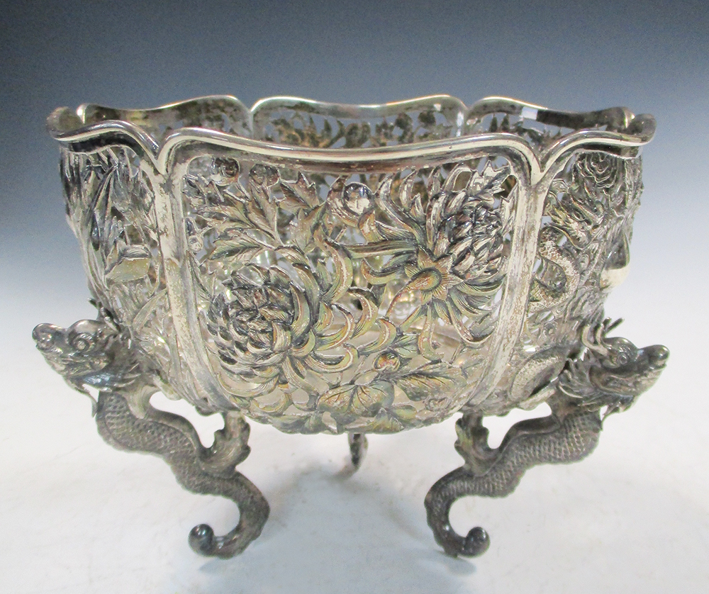Wang Hing, a reticulated silver bowl, the lobed side with panels of dragons, irises and - Image 3 of 6