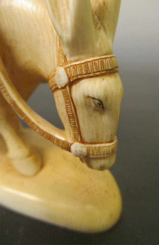 An early 20th century ivory figure of Fukurokuju riding a donkey with one hand on his straw hat - Image 3 of 4