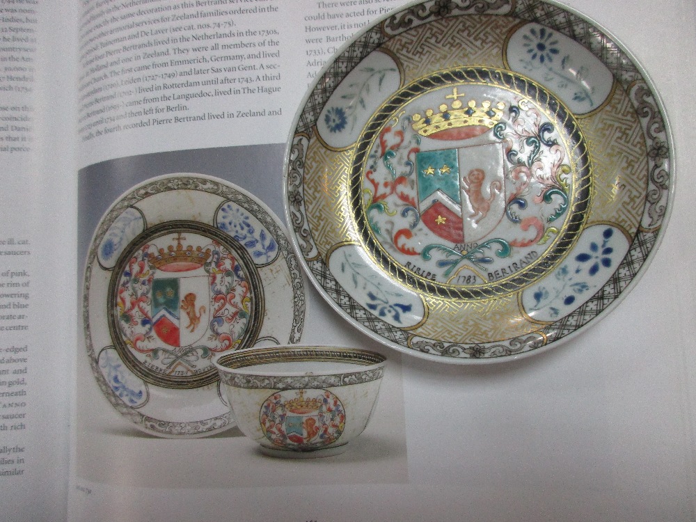 An armorial tea bowl and saucer and another famille rose, the first bearing the arms of the Dutch - Image 2 of 3