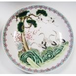 A 20th century Canton dish, the rim band of pink ruyi lappets enclosing a scene of six cranes