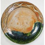 A 19th century Oribe dish, the rim with wavy line about two thirds of its diameter up to a splash of
