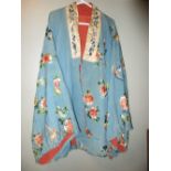 A late 19th/early 20th century turquoise silk jacket, embroidered with butterflies amongst scattered